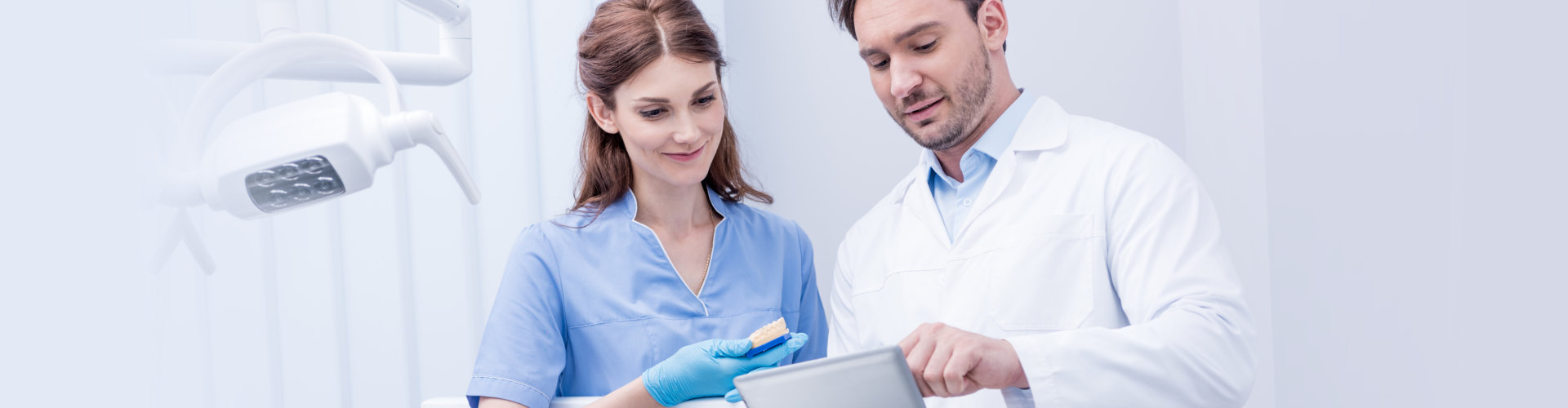 two dentists discussing work together