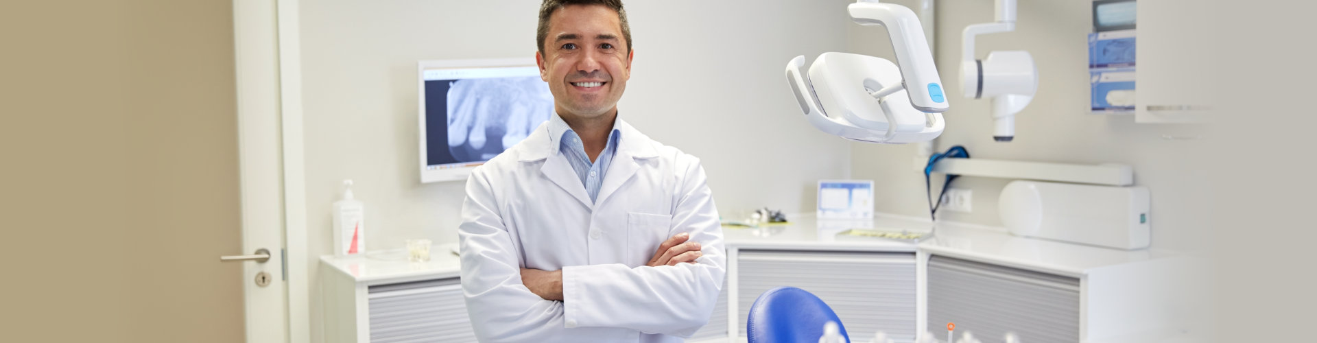 male dentist at his dental clinic